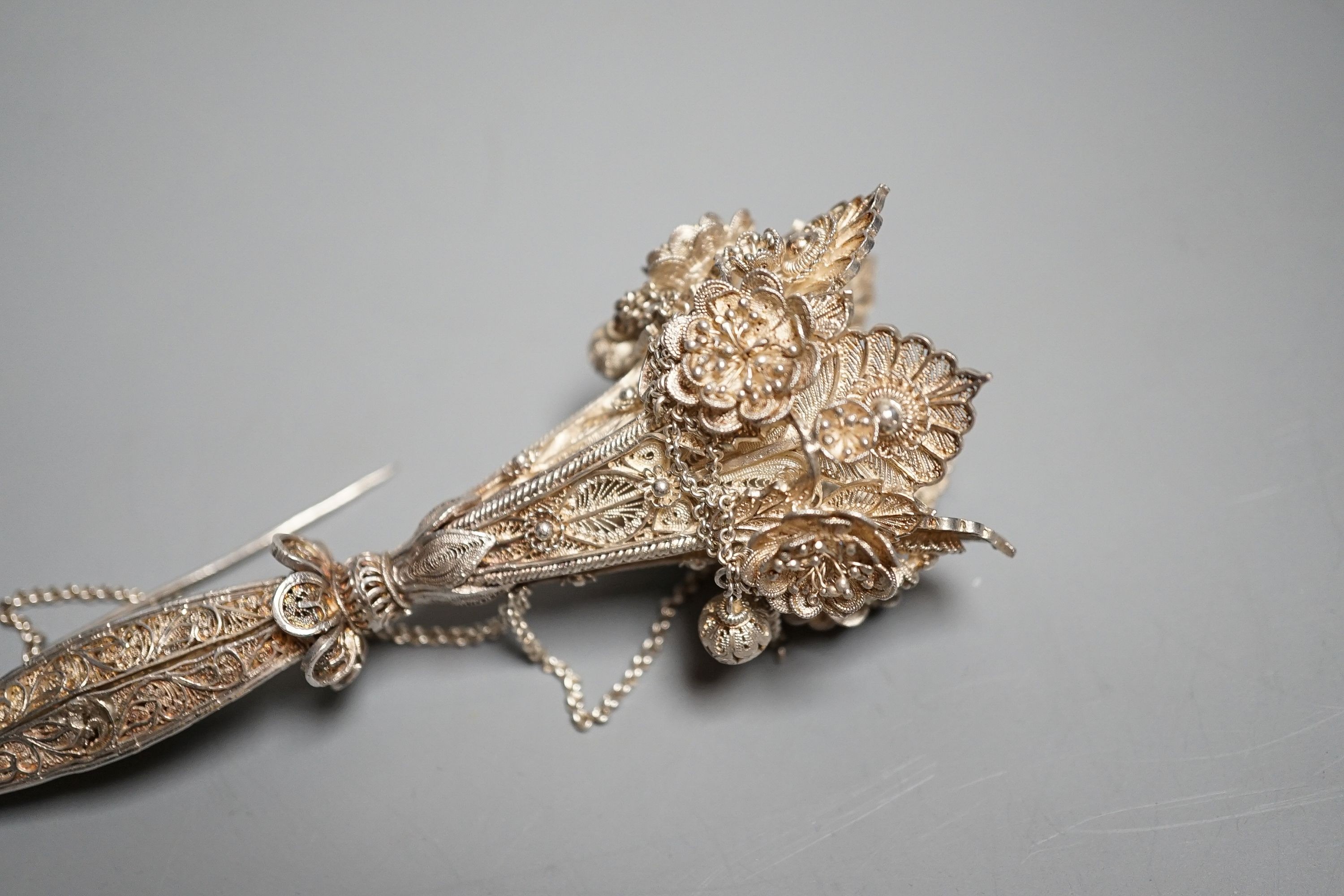 A late 19th century white metal filigree posy holder, 14.1cm. The ball at the base unscrewing to reveal three spring-loaded legs